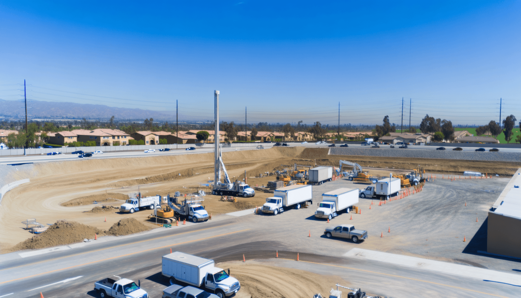 California construction business owners reviewing insurance documents at a job site